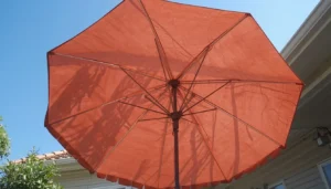 Clean outdoor umbrella fabric drying in the sun after mold treatment.