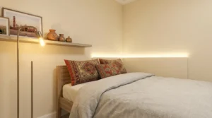 Warm bedside lamp showing how to brighten dark windowless bedroom corners.