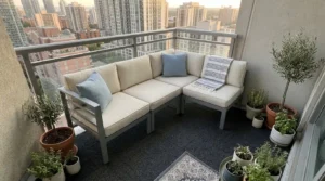 Three-piece outdoor sectional small patio layout with one chair module detached.