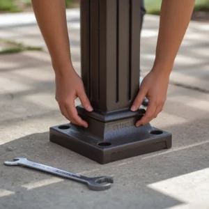 Positioning a weighted base for a patio gazebo concrete anchor installation.