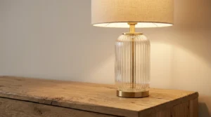 Fluted-glass lamp on raw oak used to mix art deco style with natural wood.